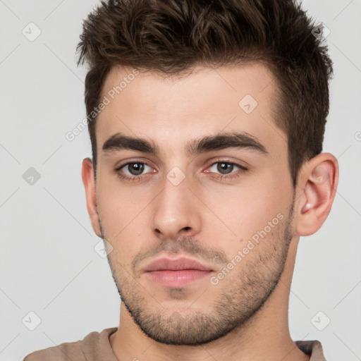 Neutral white young-adult male with short  brown hair and brown eyes