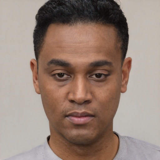 Neutral black young-adult male with short  black hair and brown eyes
