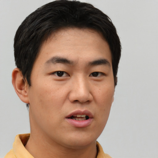 Neutral asian young-adult male with short  black hair and brown eyes