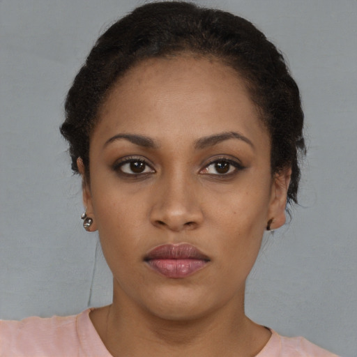 Neutral black young-adult female with short  brown hair and brown eyes