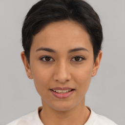 Joyful asian young-adult female with short  brown hair and brown eyes