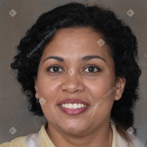 Joyful latino adult female with medium  brown hair and brown eyes