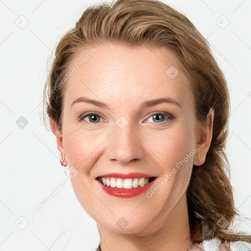 Joyful white young-adult female with medium  brown hair and blue eyes