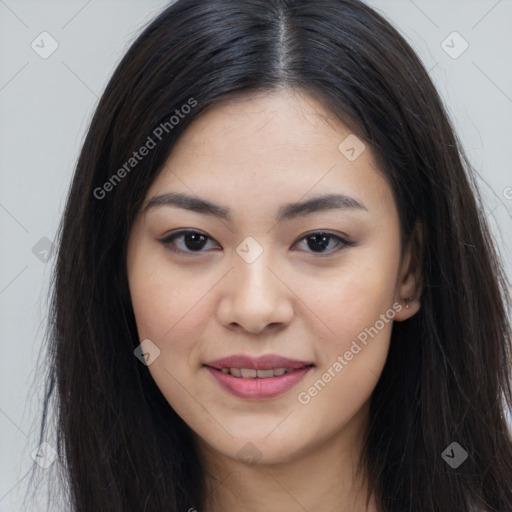 Joyful asian young-adult female with long  brown hair and brown eyes