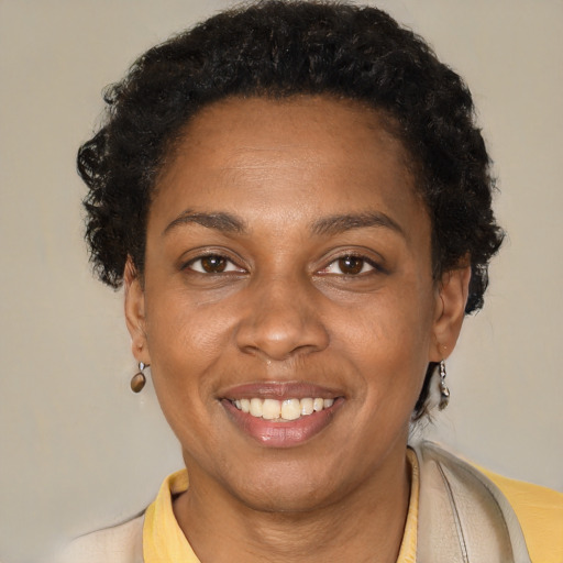 Joyful latino adult female with short  brown hair and brown eyes