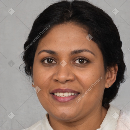 Joyful latino adult female with medium  brown hair and brown eyes