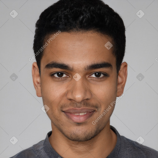 Joyful latino young-adult male with short  black hair and brown eyes