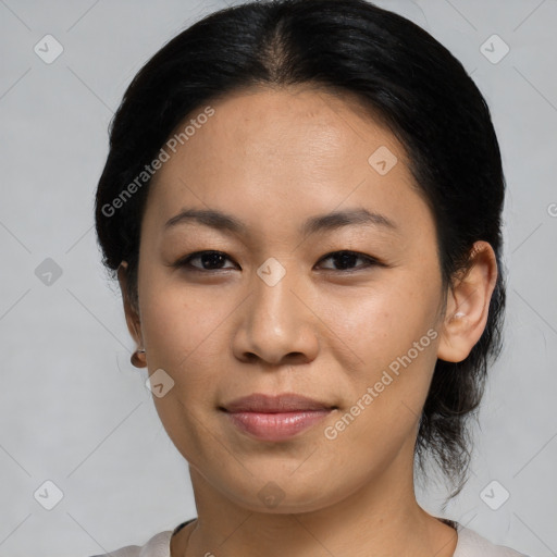 Joyful asian young-adult female with medium  black hair and brown eyes