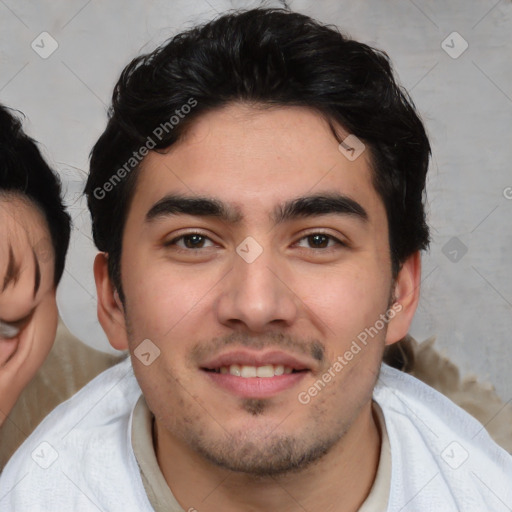 Joyful white young-adult male with short  black hair and brown eyes