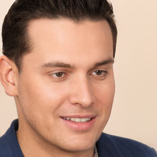 Joyful white young-adult male with short  brown hair and brown eyes