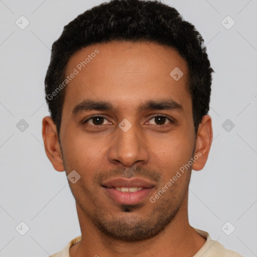 Joyful latino young-adult male with short  black hair and brown eyes