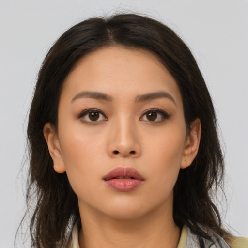 Neutral asian young-adult female with medium  brown hair and brown eyes