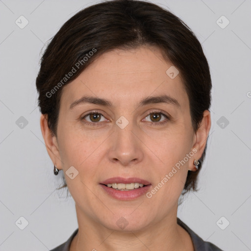 Joyful white adult female with medium  brown hair and brown eyes