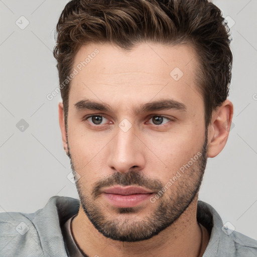 Neutral white young-adult male with short  brown hair and brown eyes