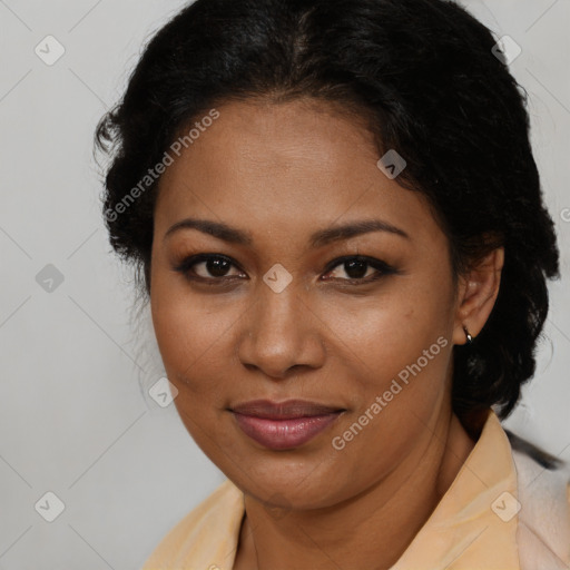 Joyful latino adult female with medium  brown hair and brown eyes