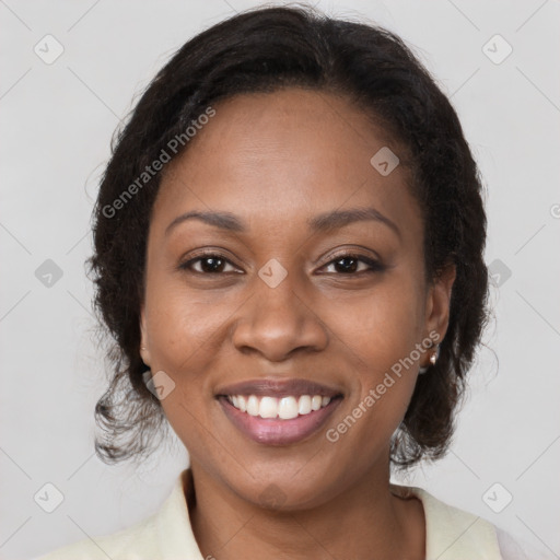 Joyful black young-adult female with medium  brown hair and brown eyes