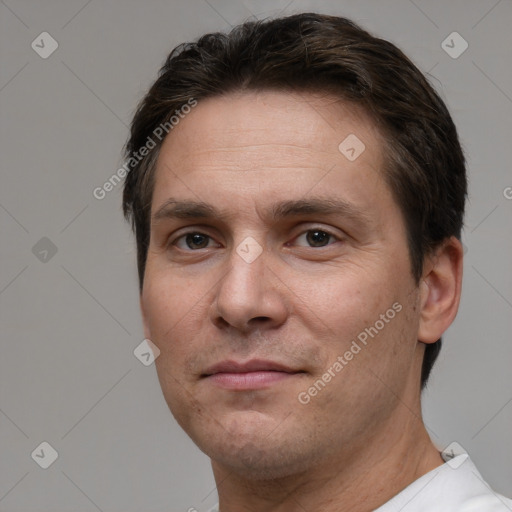 Joyful white adult male with short  brown hair and brown eyes