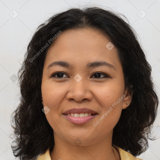 Joyful asian young-adult female with long  brown hair and brown eyes