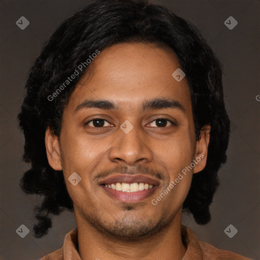 Joyful black young-adult male with short  black hair and brown eyes