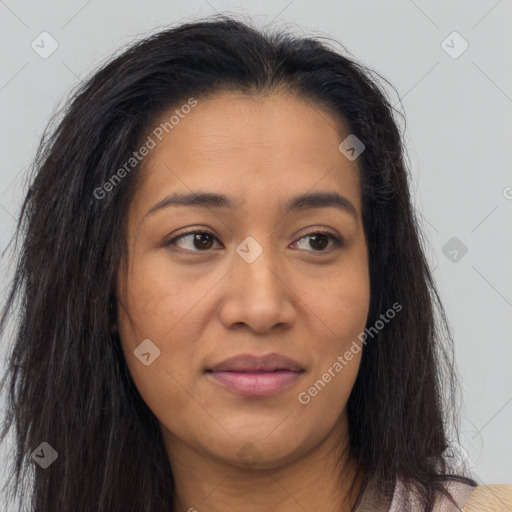 Joyful latino young-adult female with long  brown hair and brown eyes