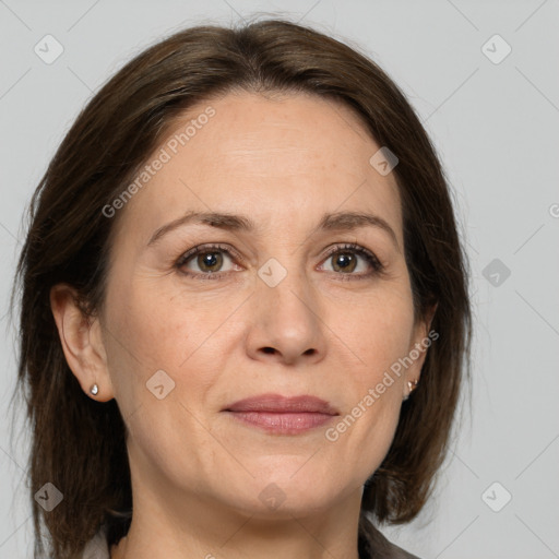 Joyful white adult female with medium  brown hair and grey eyes