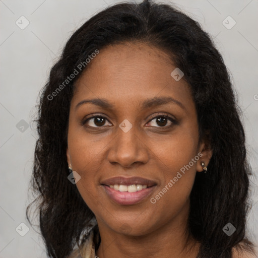 Joyful black young-adult female with long  brown hair and brown eyes