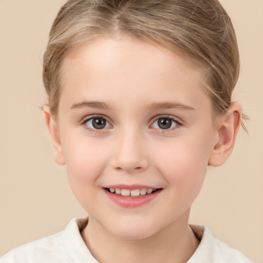 Joyful white child female with short  brown hair and brown eyes