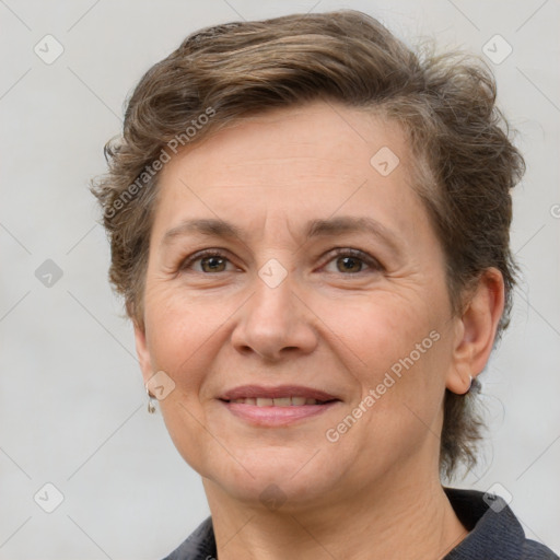 Joyful white adult female with short  brown hair and brown eyes