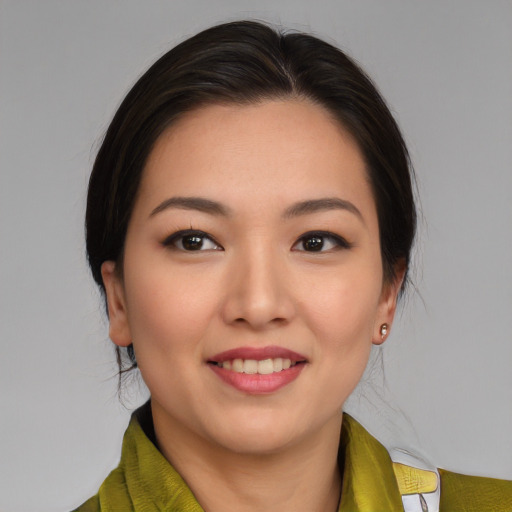 Joyful asian young-adult female with medium  brown hair and brown eyes