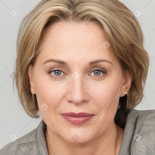 Joyful white adult female with medium  brown hair and grey eyes