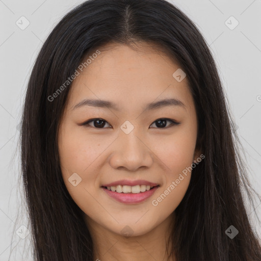 Joyful asian young-adult female with long  brown hair and brown eyes