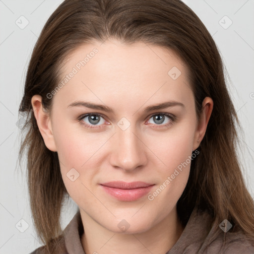 Joyful white young-adult female with long  brown hair and grey eyes