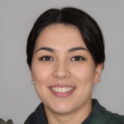 Joyful asian young-adult female with medium  brown hair and brown eyes