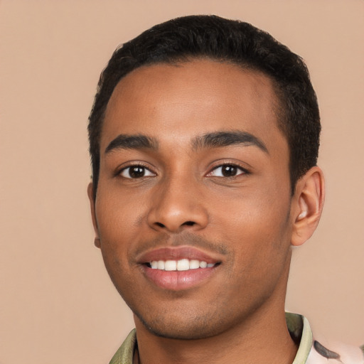 Joyful latino young-adult male with short  black hair and brown eyes