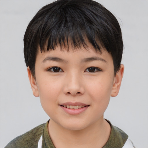 Joyful asian child female with short  brown hair and brown eyes