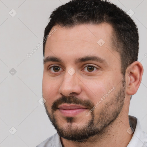 Joyful white young-adult male with short  brown hair and brown eyes