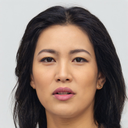 Joyful asian young-adult female with long  black hair and brown eyes