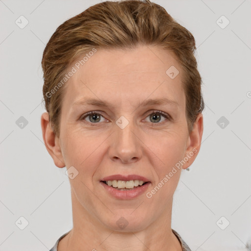 Joyful white adult female with short  brown hair and grey eyes