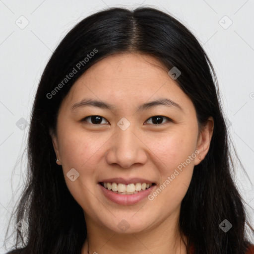 Joyful white young-adult female with long  brown hair and brown eyes