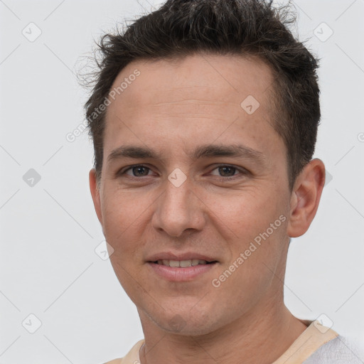 Joyful white young-adult male with short  brown hair and brown eyes