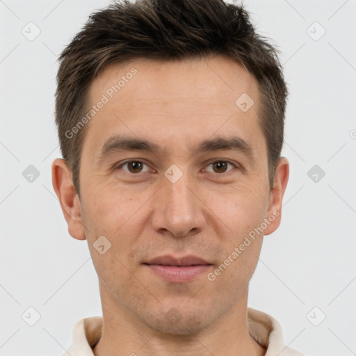 Joyful white adult male with short  brown hair and brown eyes