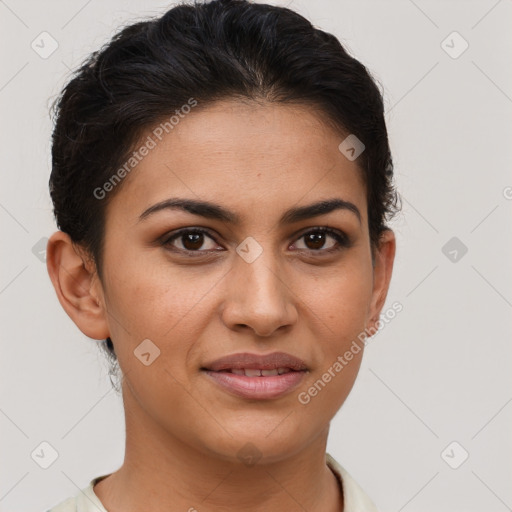 Joyful latino young-adult female with short  brown hair and brown eyes