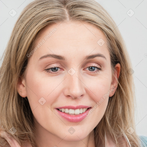 Joyful white young-adult female with long  brown hair and blue eyes