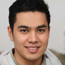 Joyful latino young-adult male with short  brown hair and brown eyes