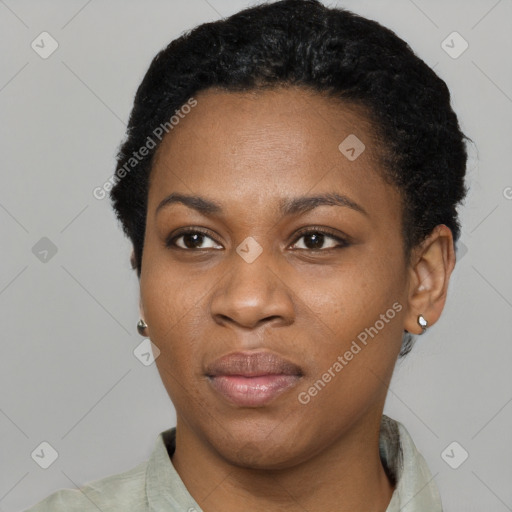 Joyful black young-adult female with short  black hair and brown eyes