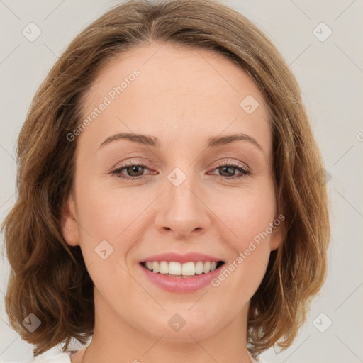 Joyful white young-adult female with medium  brown hair and green eyes