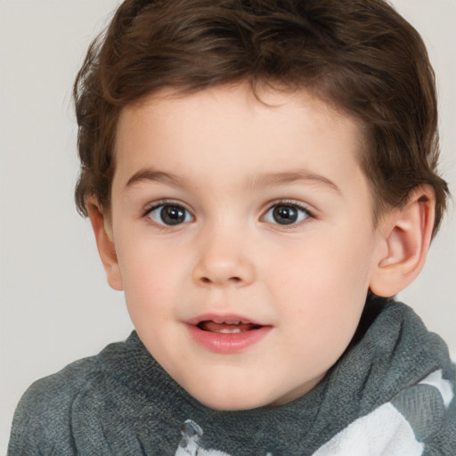 Joyful white child male with short  brown hair and brown eyes