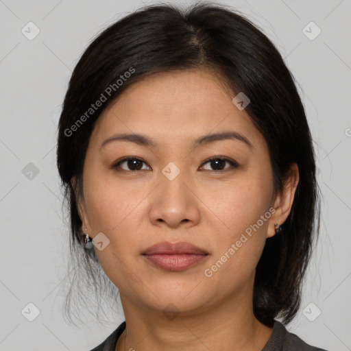 Joyful asian young-adult female with medium  brown hair and brown eyes