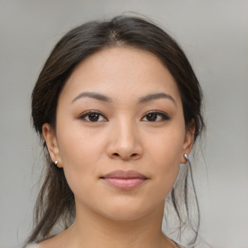 Joyful asian young-adult female with medium  brown hair and brown eyes