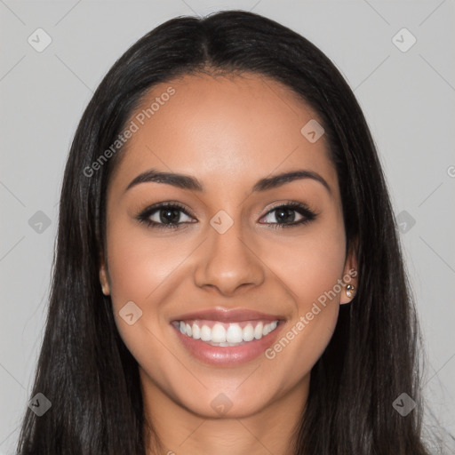 Joyful latino young-adult female with long  black hair and brown eyes